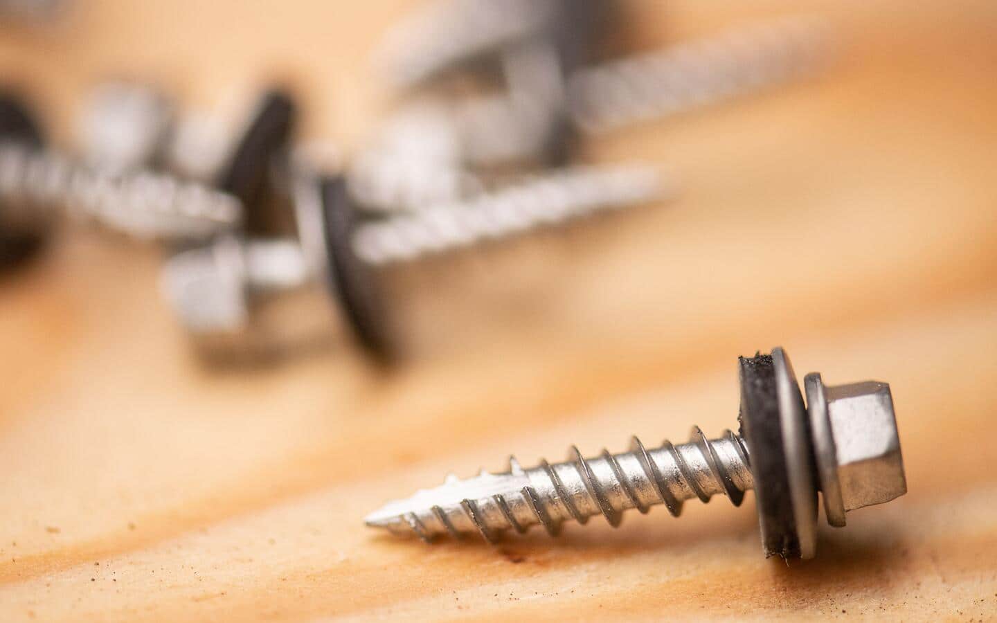 A hex drive, self-drilling sheet metal screw with a washer, also called a roofing screw. A hex drive, self-drilling sheet metal screw with a washer, also called a roofing screw.