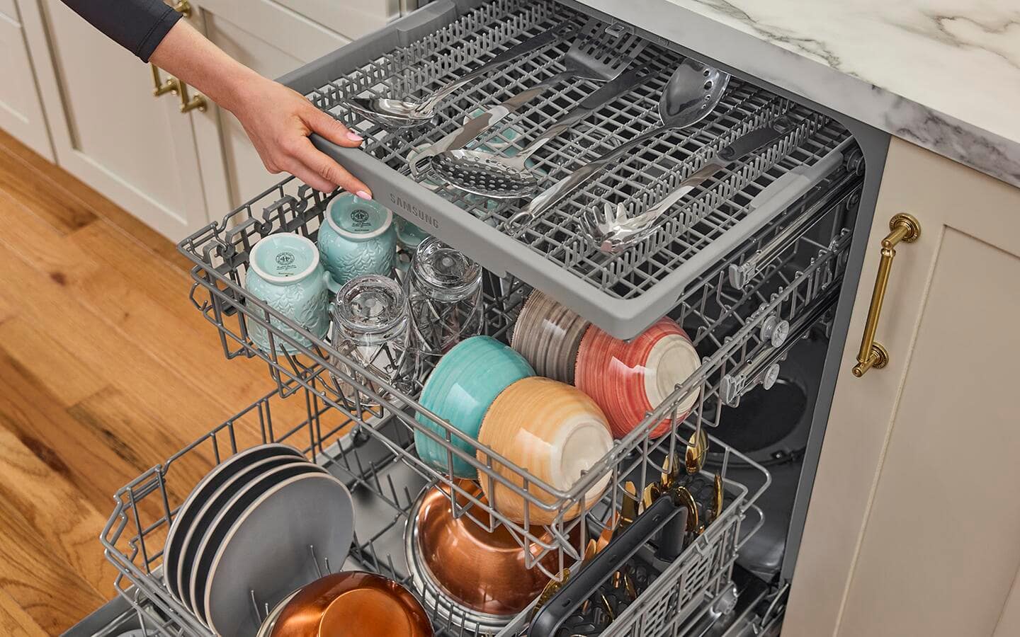 An open built-in dishwasher revealing a rack filled with dishes An open built-in dishwasher revealing a rack filled with dishes