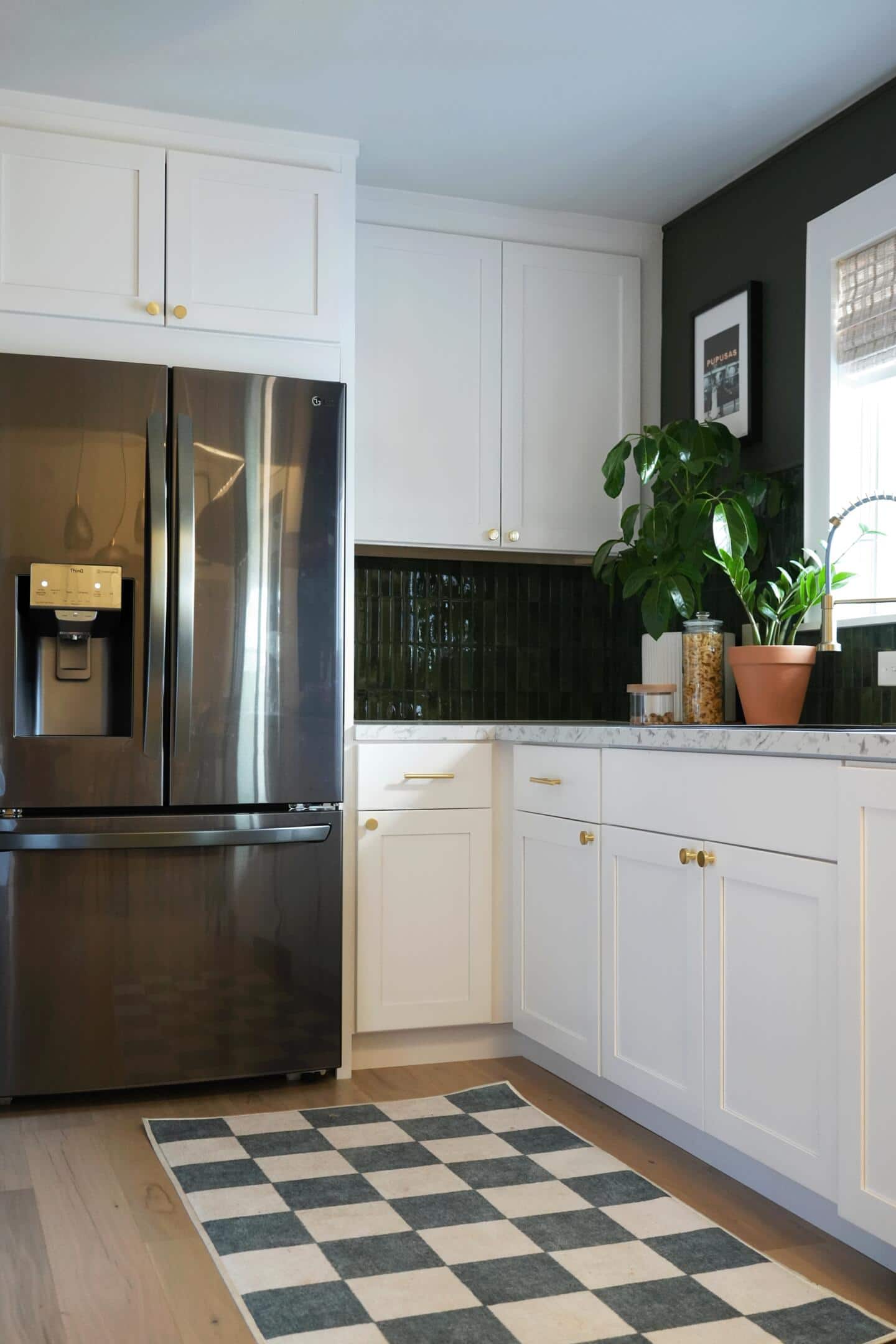 A finished look at the re-vamped kitchen with new cabinets, cabinet hardware and countertops. 