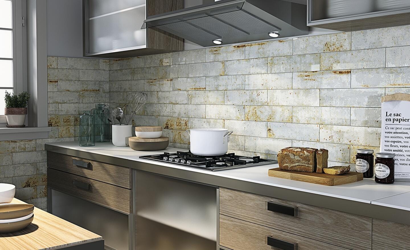 A kitchen with a tile wall
