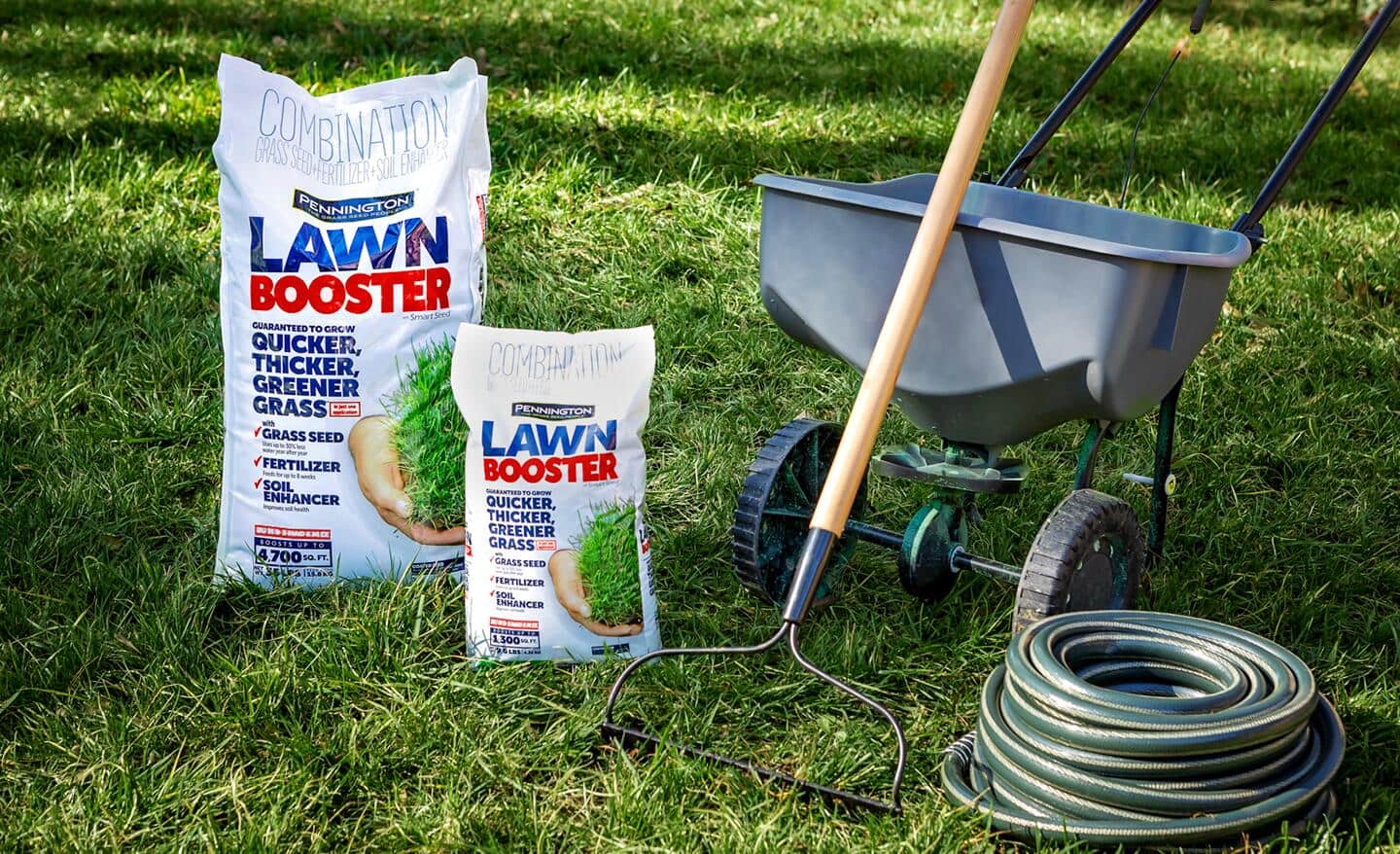 Bags of fertilizer, a spreader, hose and garden tools. Bags of fertilizer, a spreader, hose and garden tools.