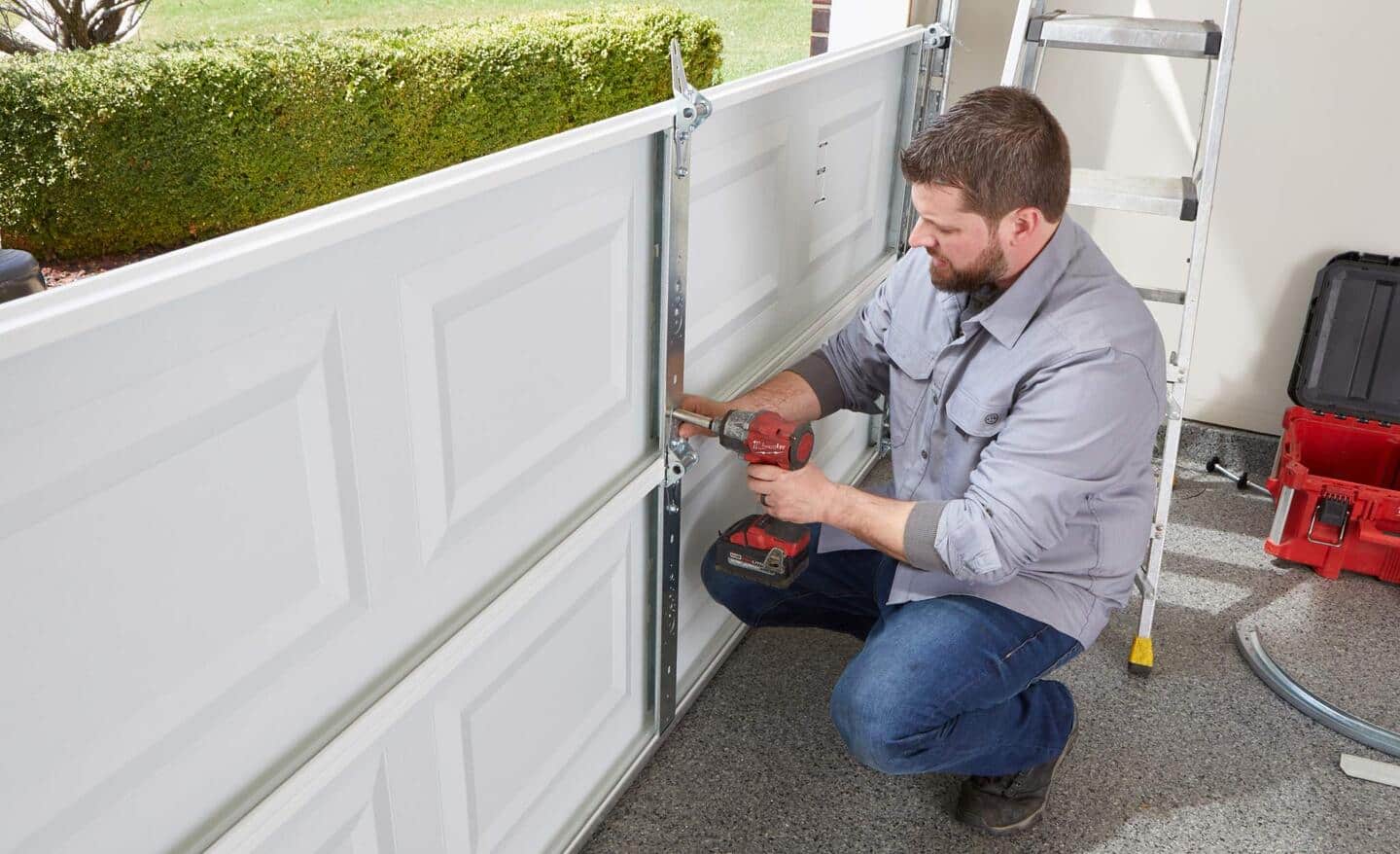 A Pro installs a new garage door