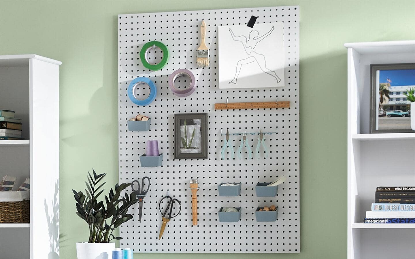 Crafting supplies stored on a pegboard and Circuit machine Crafting supplies stored on a pegboard and Circuit machine