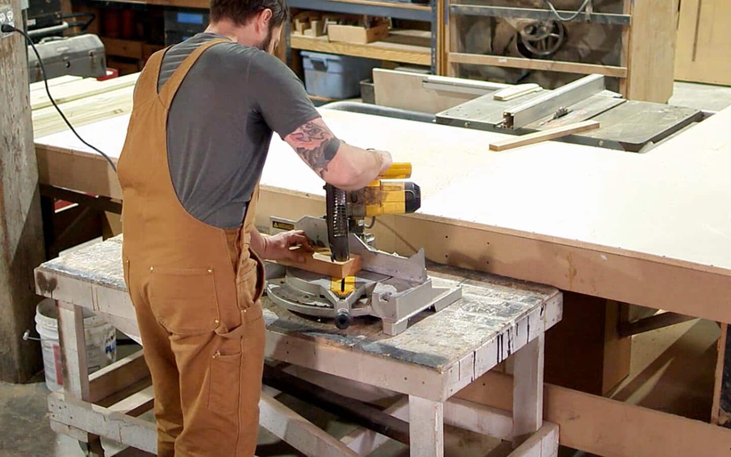 A person cutting into a board. A person cutting into a board.