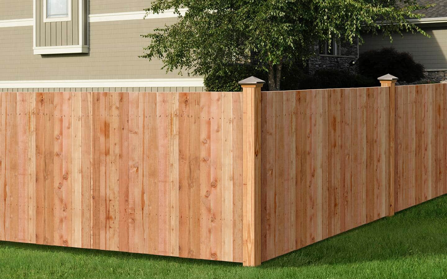 A new fence stands outside of a home.