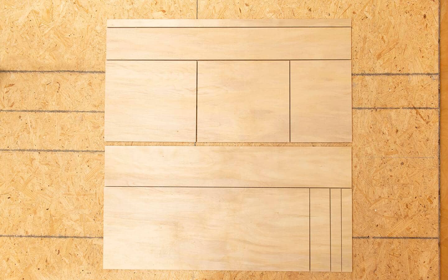 Two plywood project panels that have been cut into the basic pieces to build a DIY soccer rebounder board. Two plywood project panels that have been cut into the basic pieces to build a DIY soccer rebounder board.
