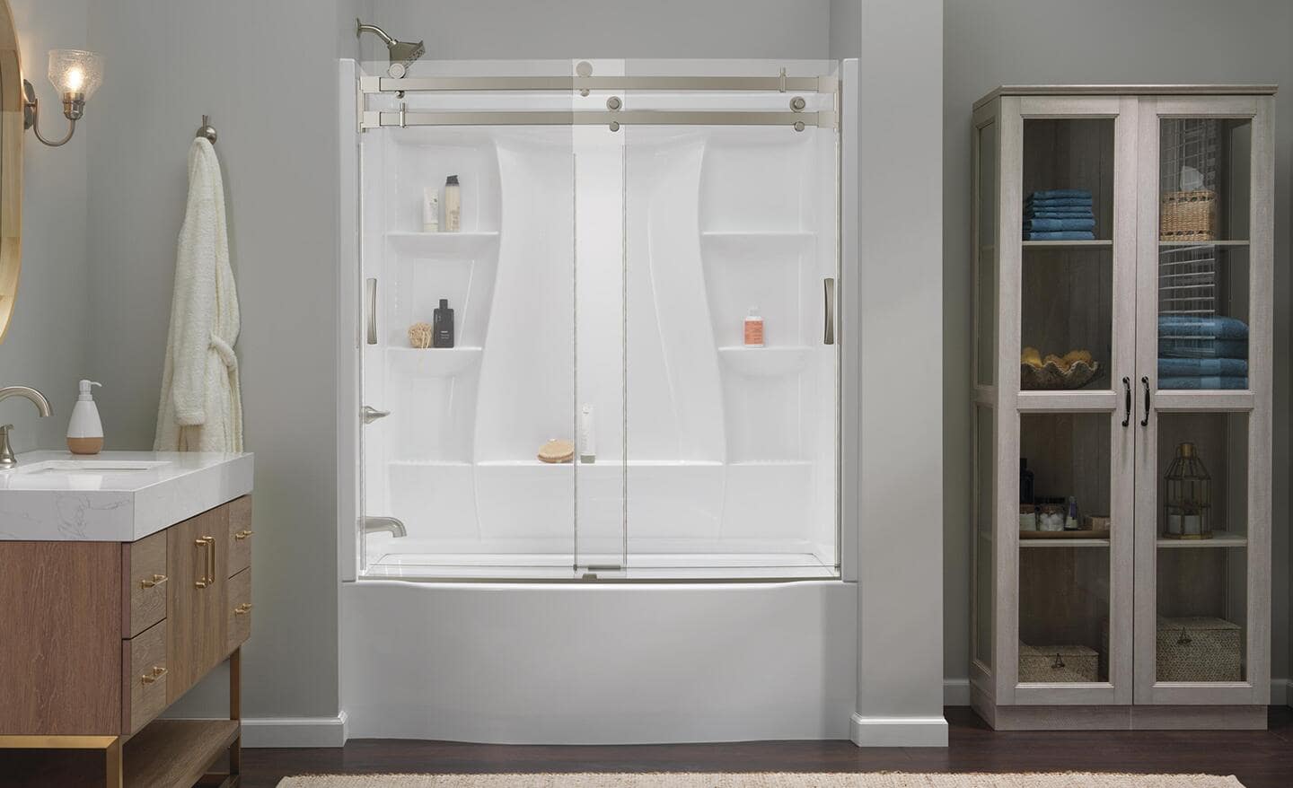 White shower and bathtub combination in a bathroom. White shower and bathtub combination in a bathroom.