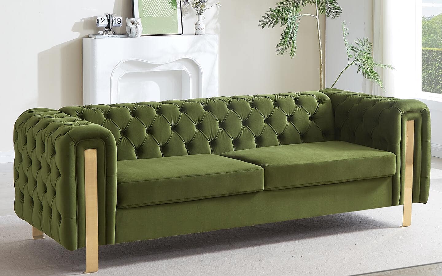 A modern-style, green velvet Chesterfield sofa featuring metal insets. A modern-style, green velvet Chesterfield sofa featuring metal insets.