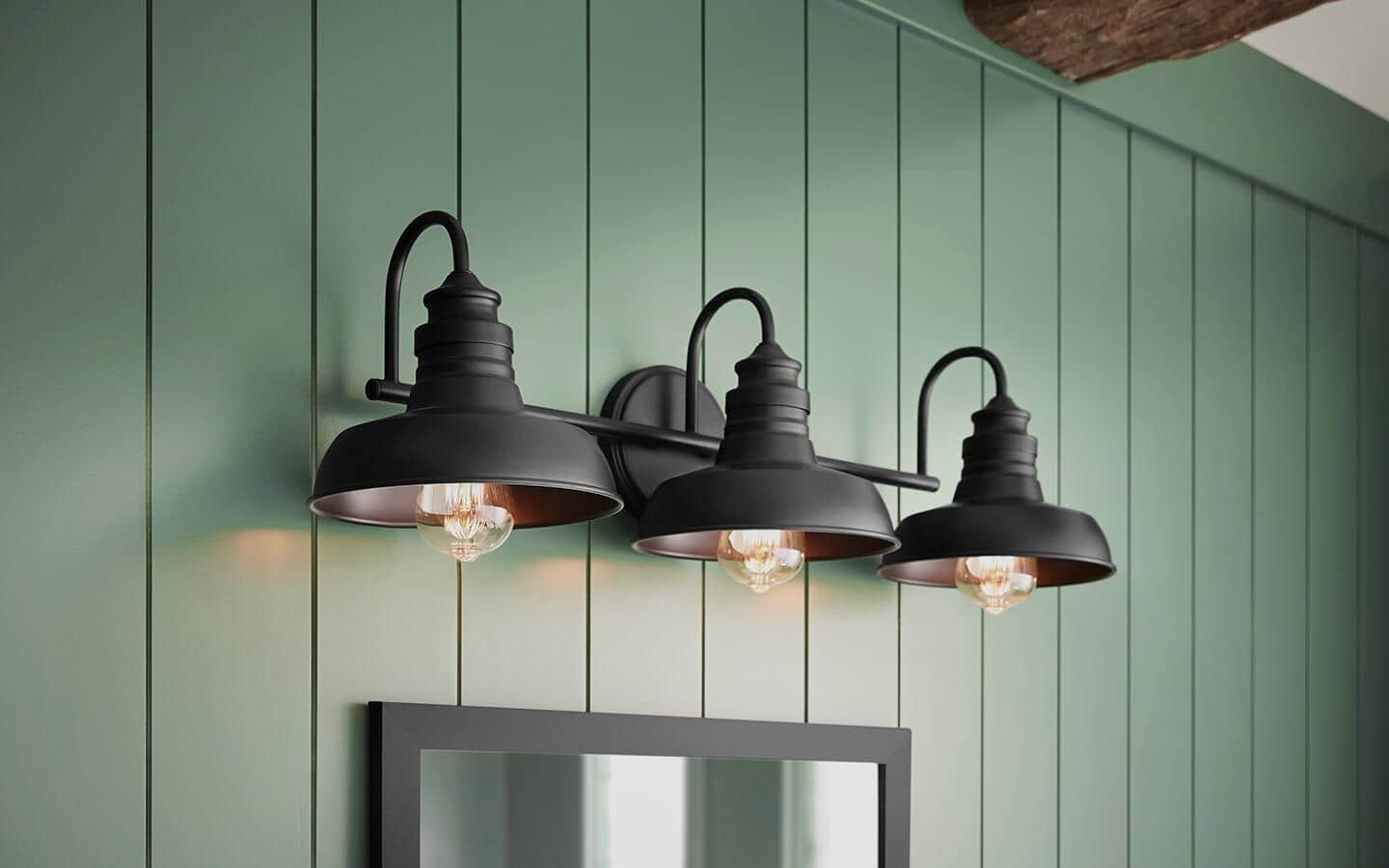 Three sconce lights installed on a painted panel wall. Three sconce lights installed on a painted panel wall.