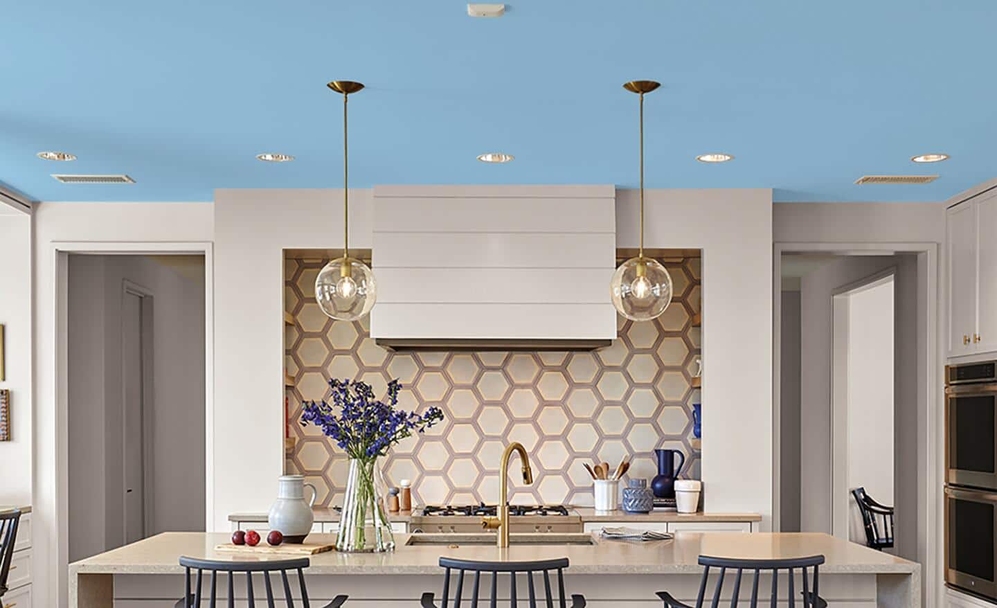 A modern kitchen featuring a light blue ceiling. A modern kitchen featuring a light blue ceiling.