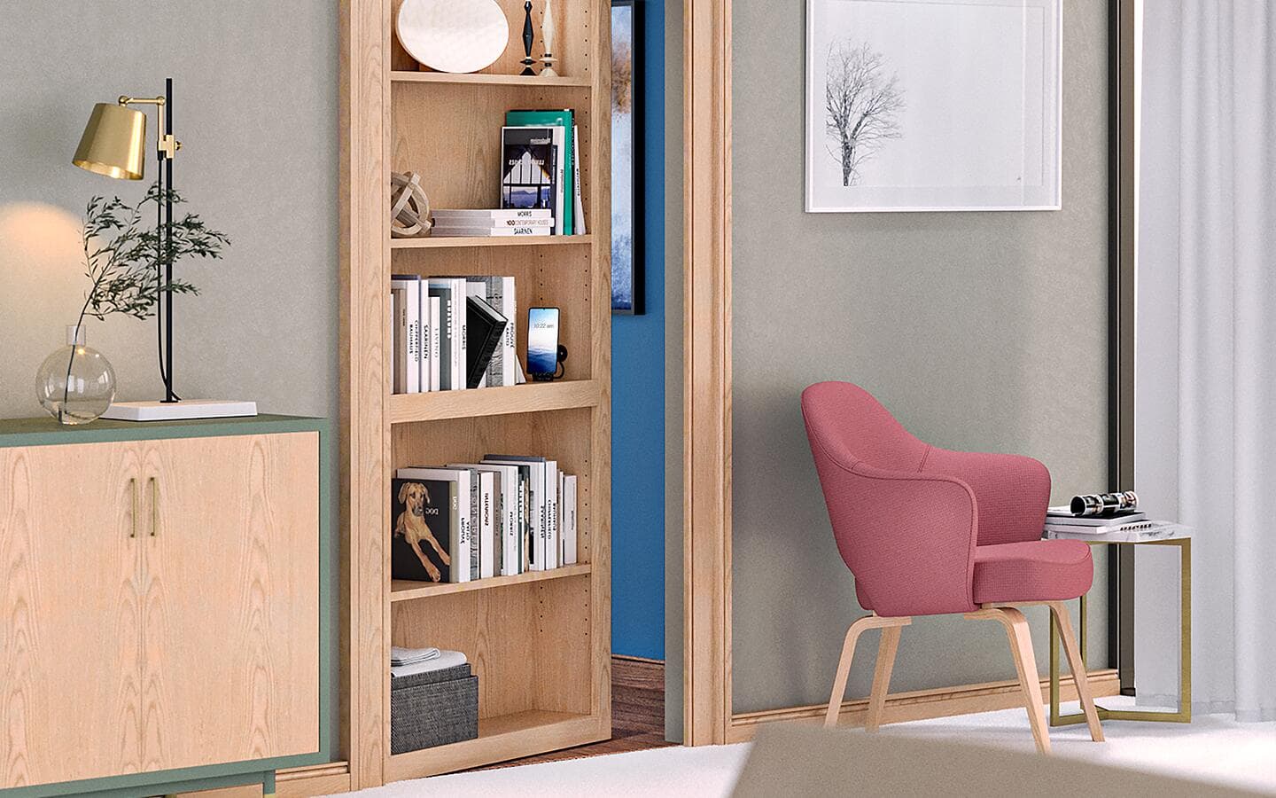 An open tan bookcase door between a tan cabinet and pink chair. An open tan bookcase door between a tan cabinet and pink chair.