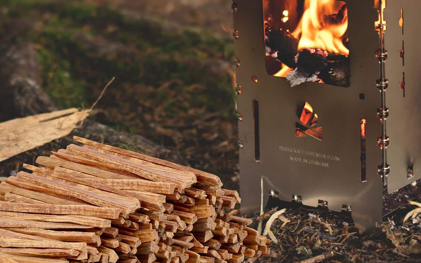 Kindling sticks stacked by a wood smoker