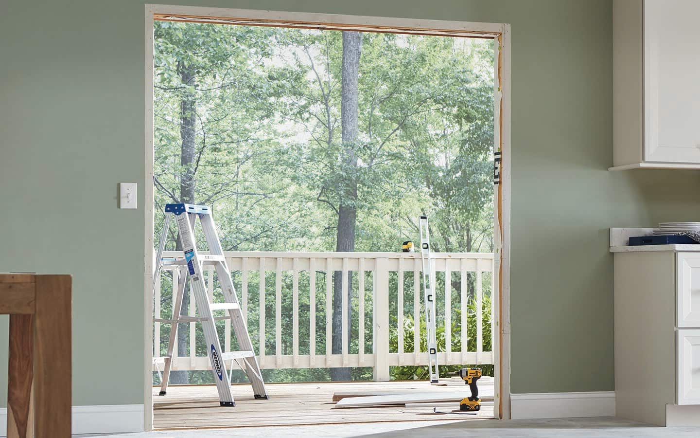 A door frame reveals the outside deck railing.