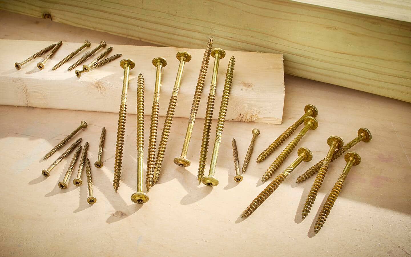 Structural screws, or lag screw replacements, with a coating that is rated for exterior environments and pressure treated wood.
