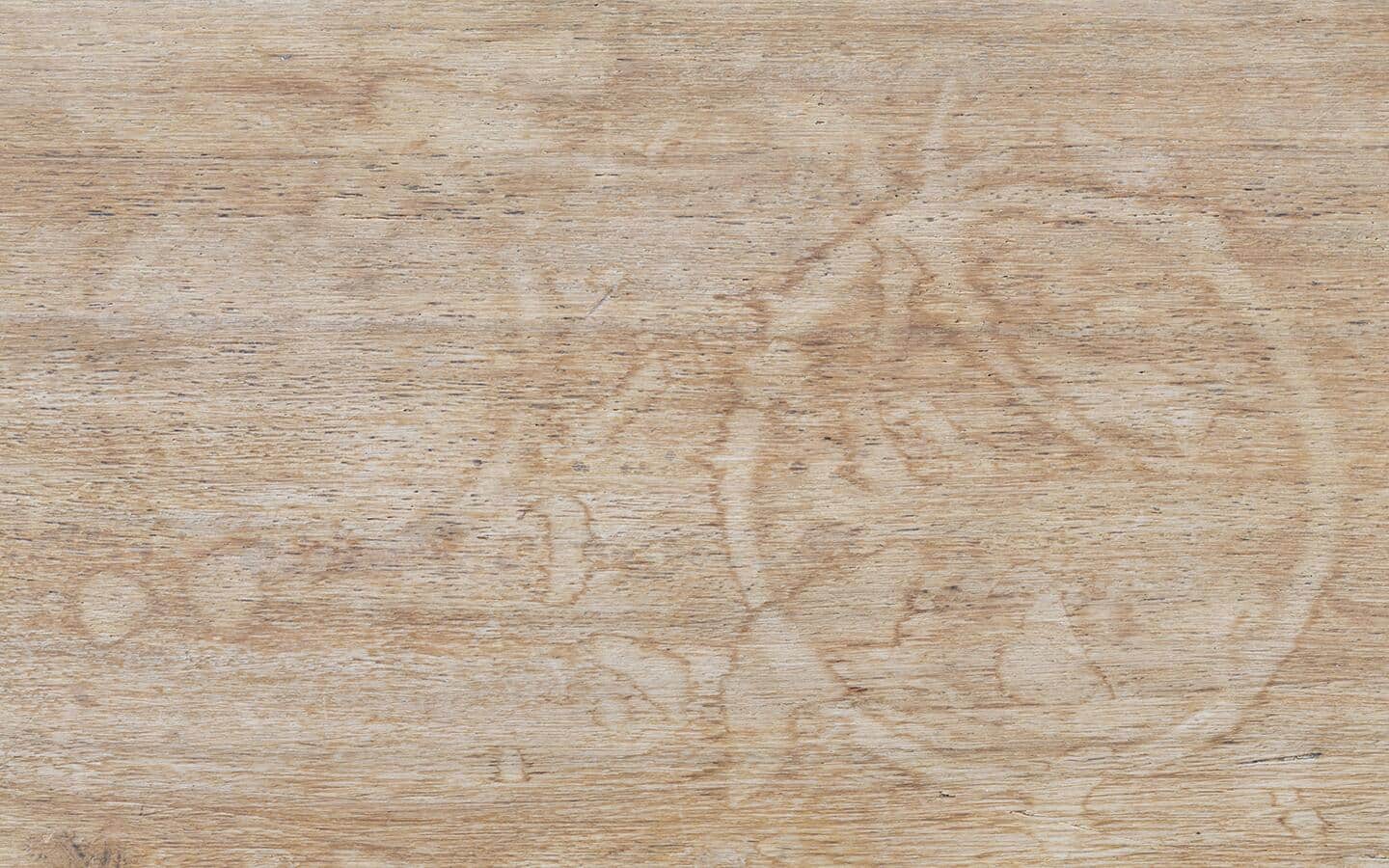 A wood surface covered with water spots.