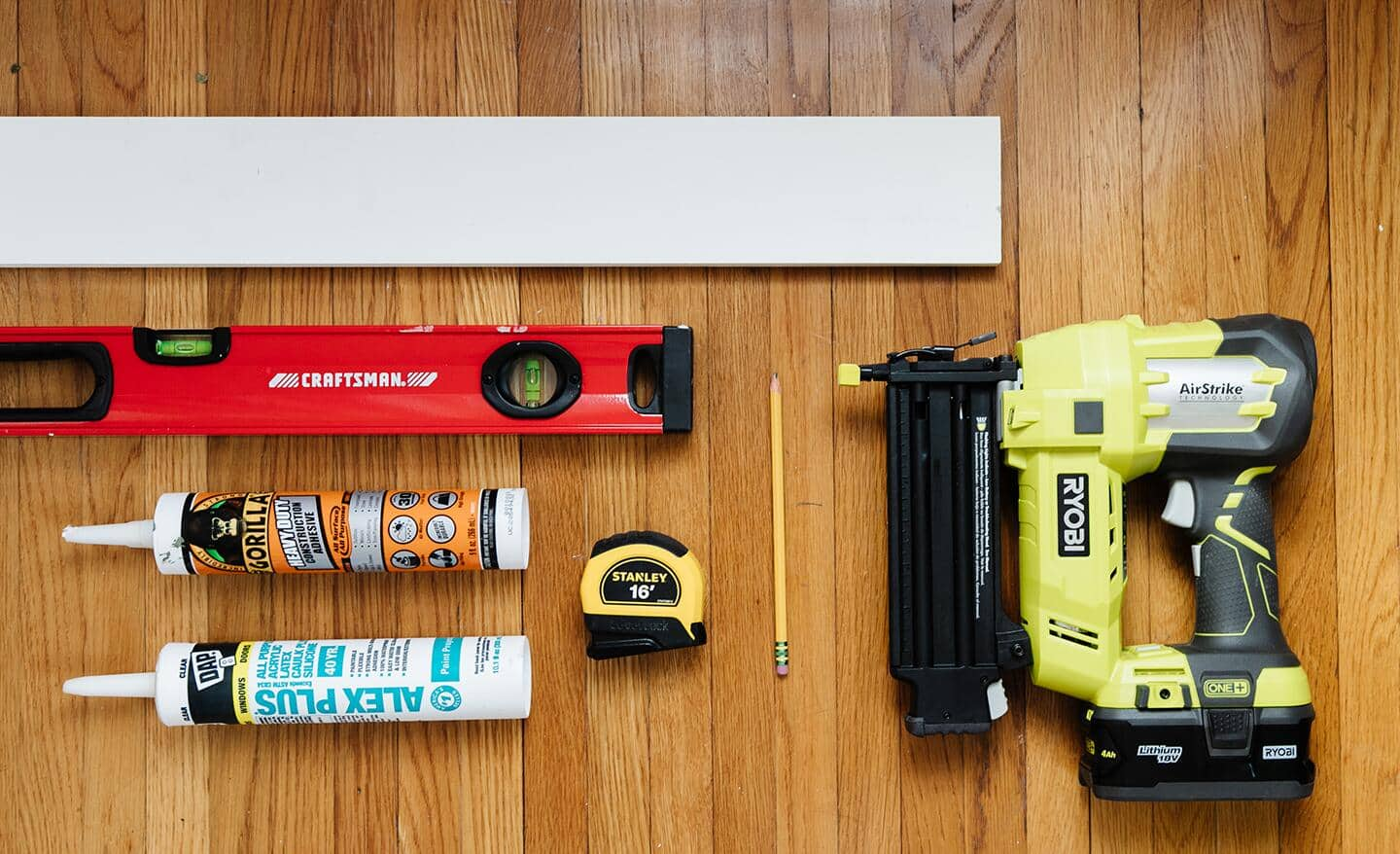 Tools and materials for a board and batten accent wall.