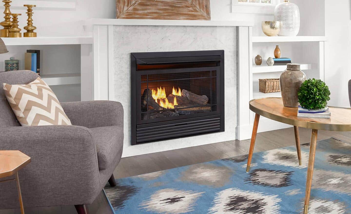 Flames flicker in a black, gas fireplace insert installed in a white fireplace. Flames flicker in a black, gas fireplace insert installed in a white fireplace.