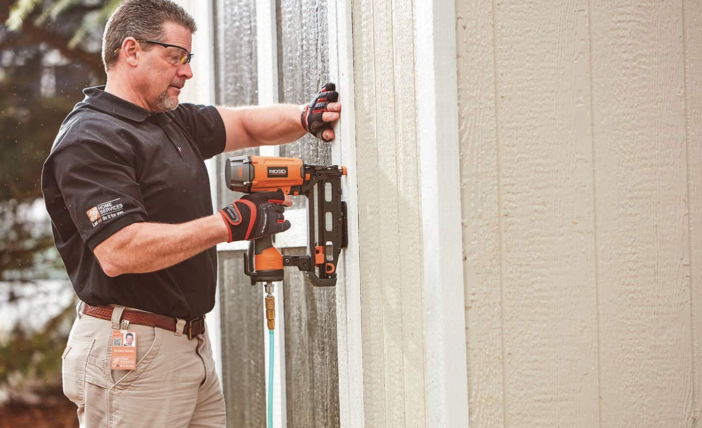 A Home Depot professional installing an outdoor shed.