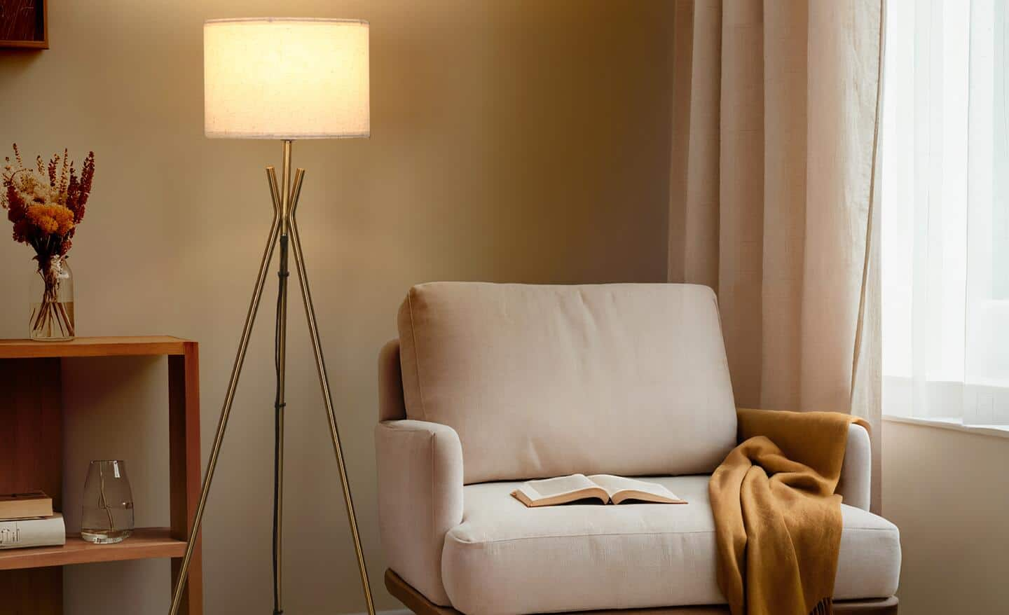 A tripod floor lamp sits behind a white armchair in a living room.