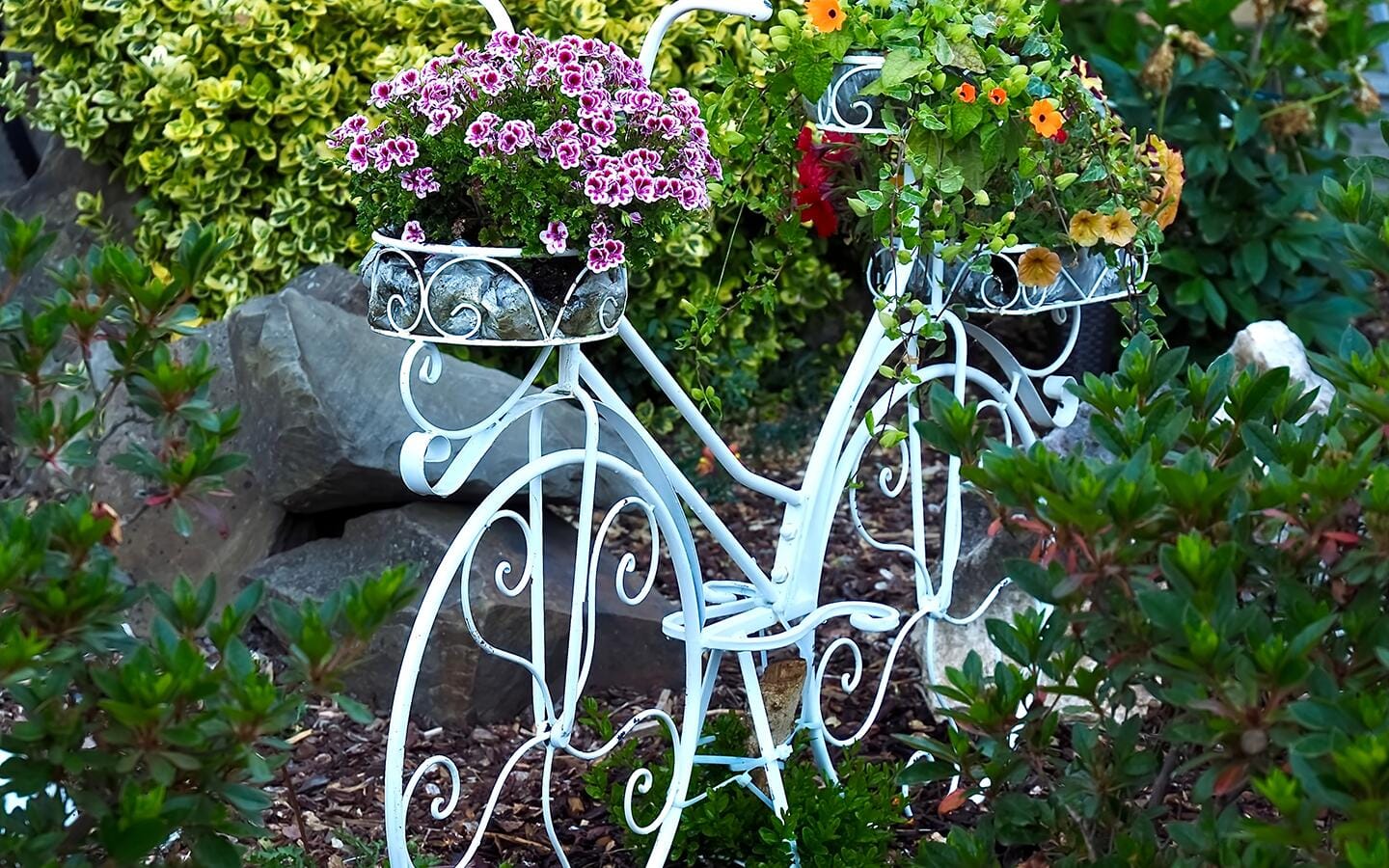 Whimsical caterpillar statue in a home garden.