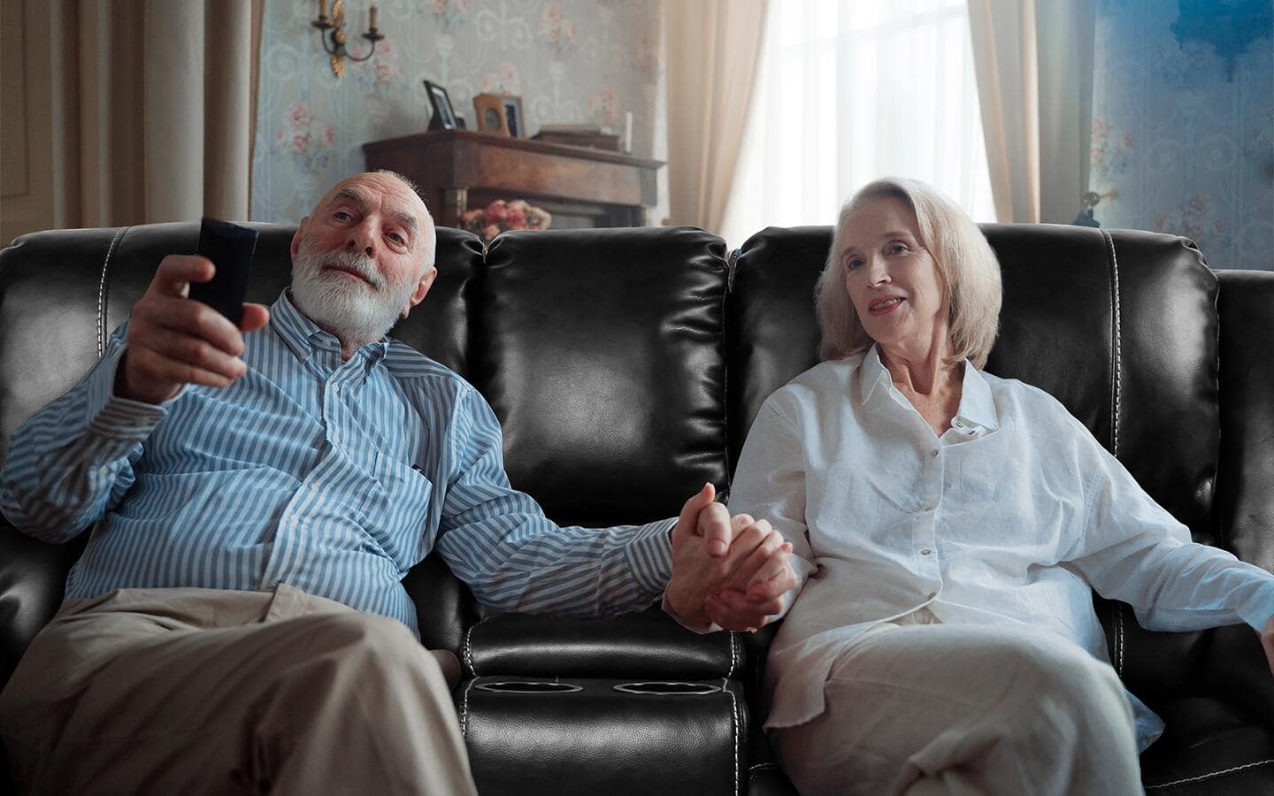 Couple sitting on a reclining couch. Couple sitting on a reclining couch.