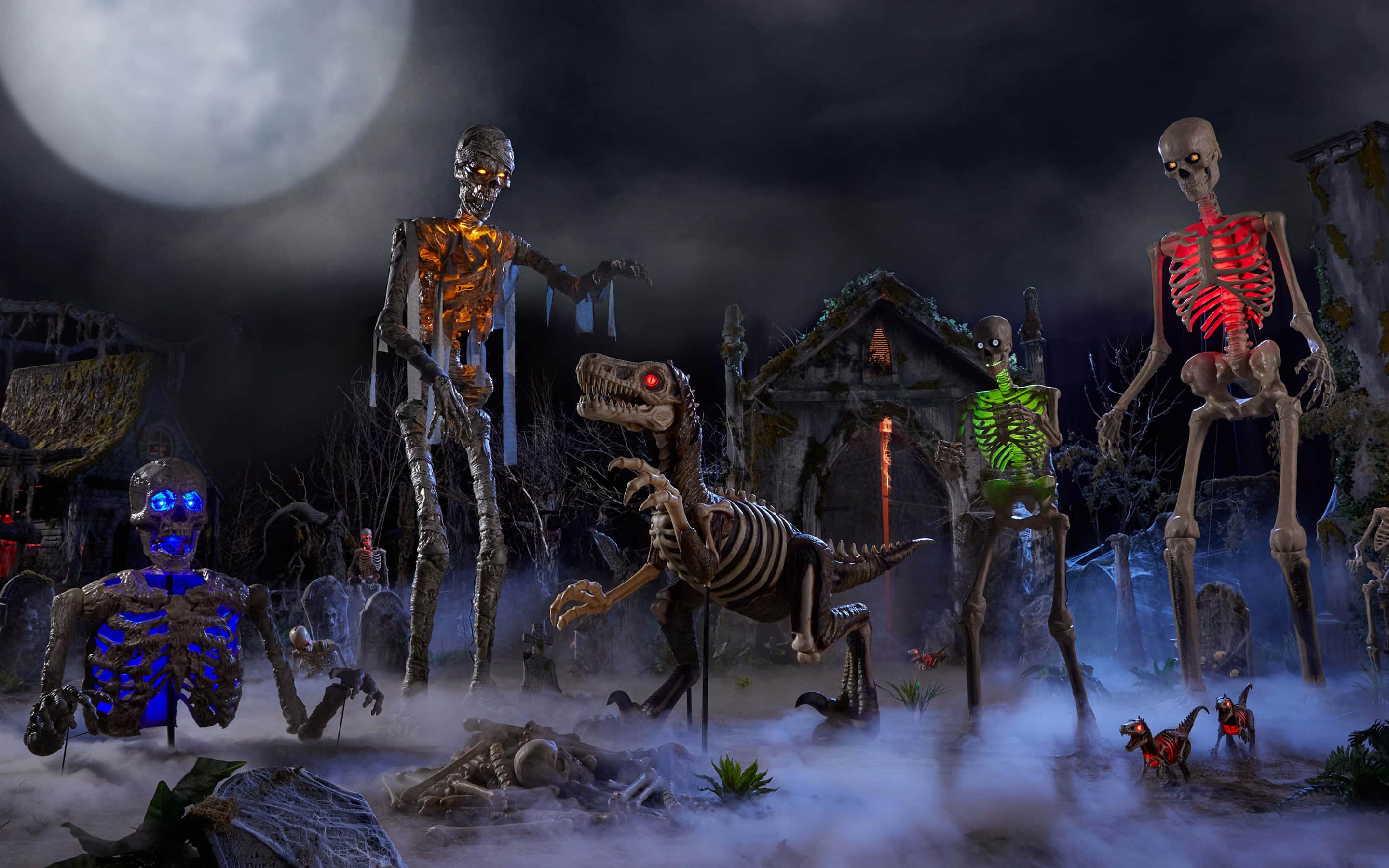 A Halloween scene with 12 foot skeletons, a dinosaur and other spooky bones.