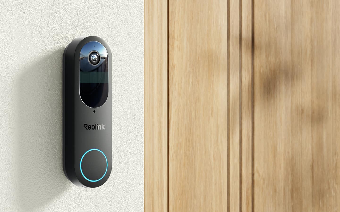 A wireless doorbell with a light blue ring light installed next to wooden front door. A wireless doorbell with a light blue ring light installed next to wooden front door.