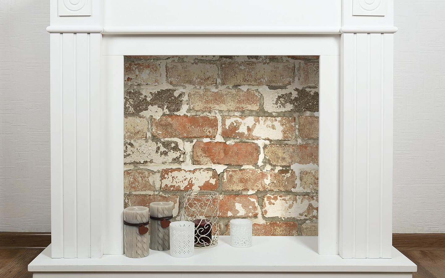 An unused fireplace is repurposed as a decorative focal point with brick-look peel and stick wallpaper. An unused fireplace is repurposed as a decorative focal point with brick-look peel and stick wallpaper.