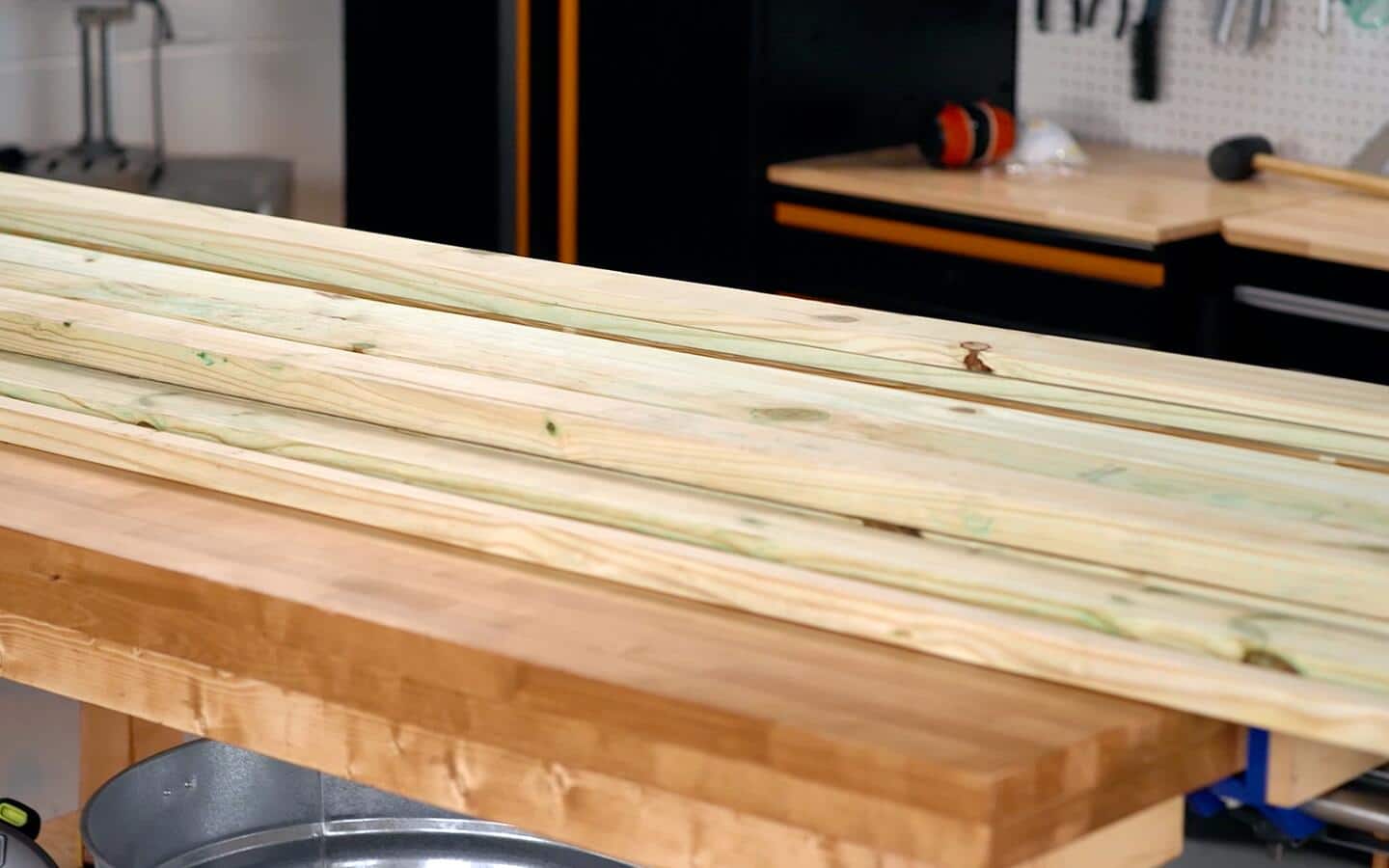 Multiple stacked wood boards for a sofa in a workshop. Multiple stacked wood boards for a sofa in a workshop.