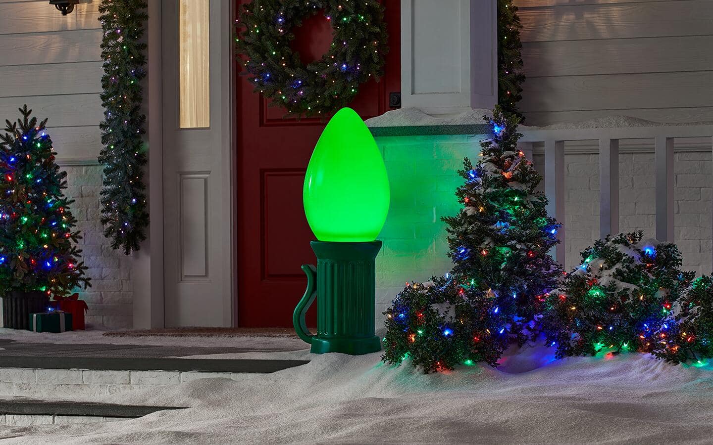 Bulb-shaped light placed by the front door. Bulb-shaped light placed by the front door.