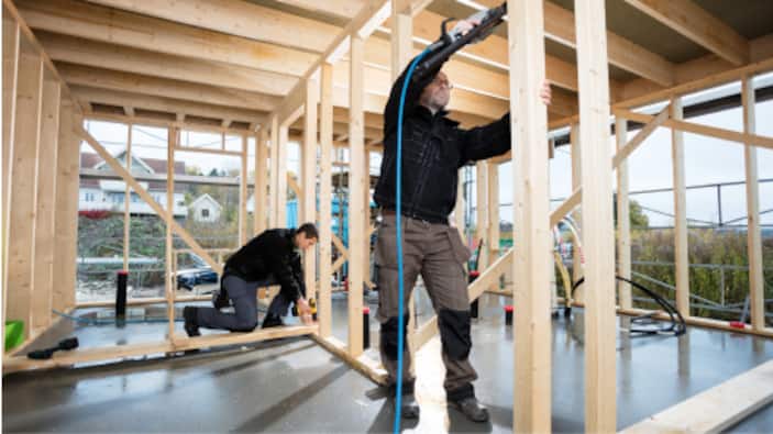 A carpenter frames a new home.