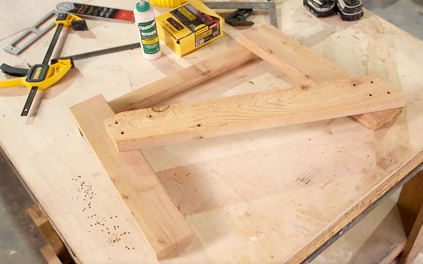 The stringer board attached to the legs of an Adirondack chair. The stringer board attached to the legs of an Adirondack chair.