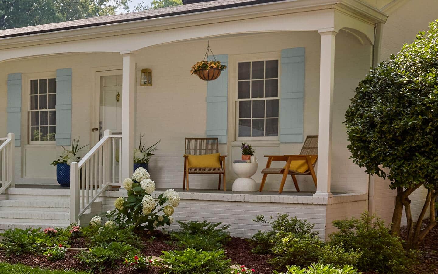 Two chairs on a front porch in spring
