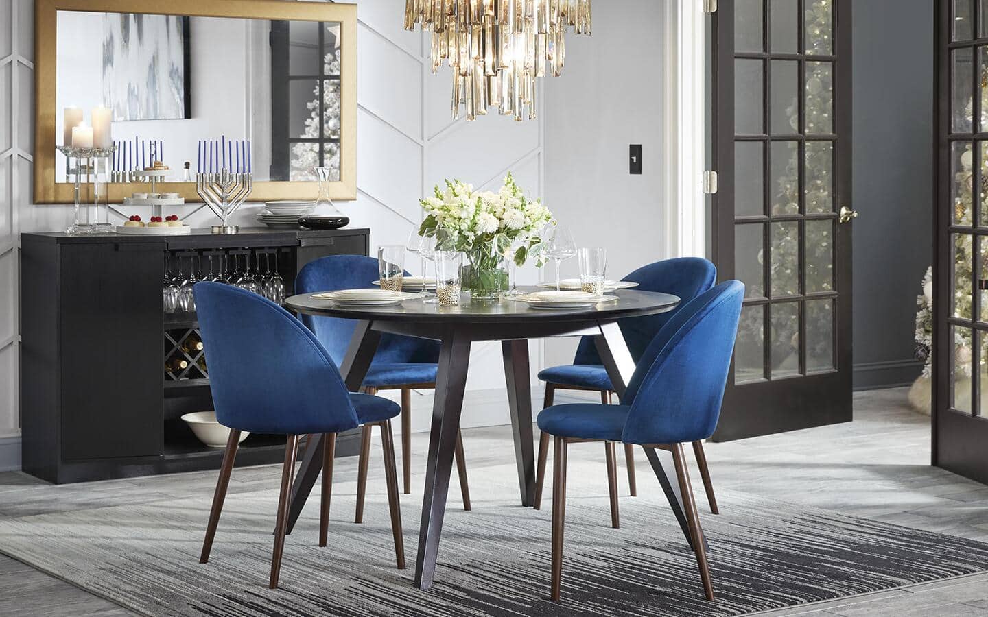Blue chairs around a circular dining table.