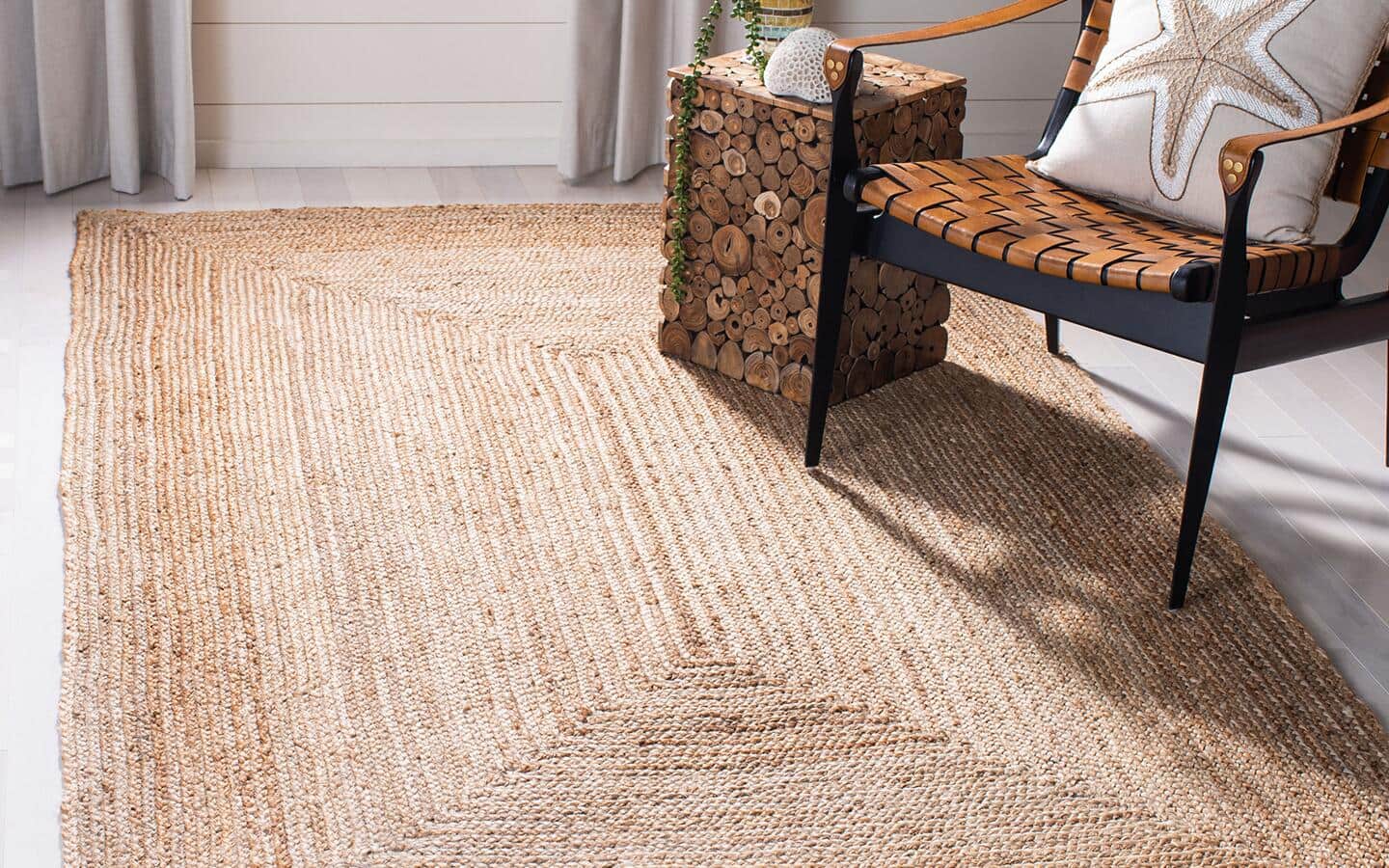  A natural rug placed in a sunny spot in front of a chair.