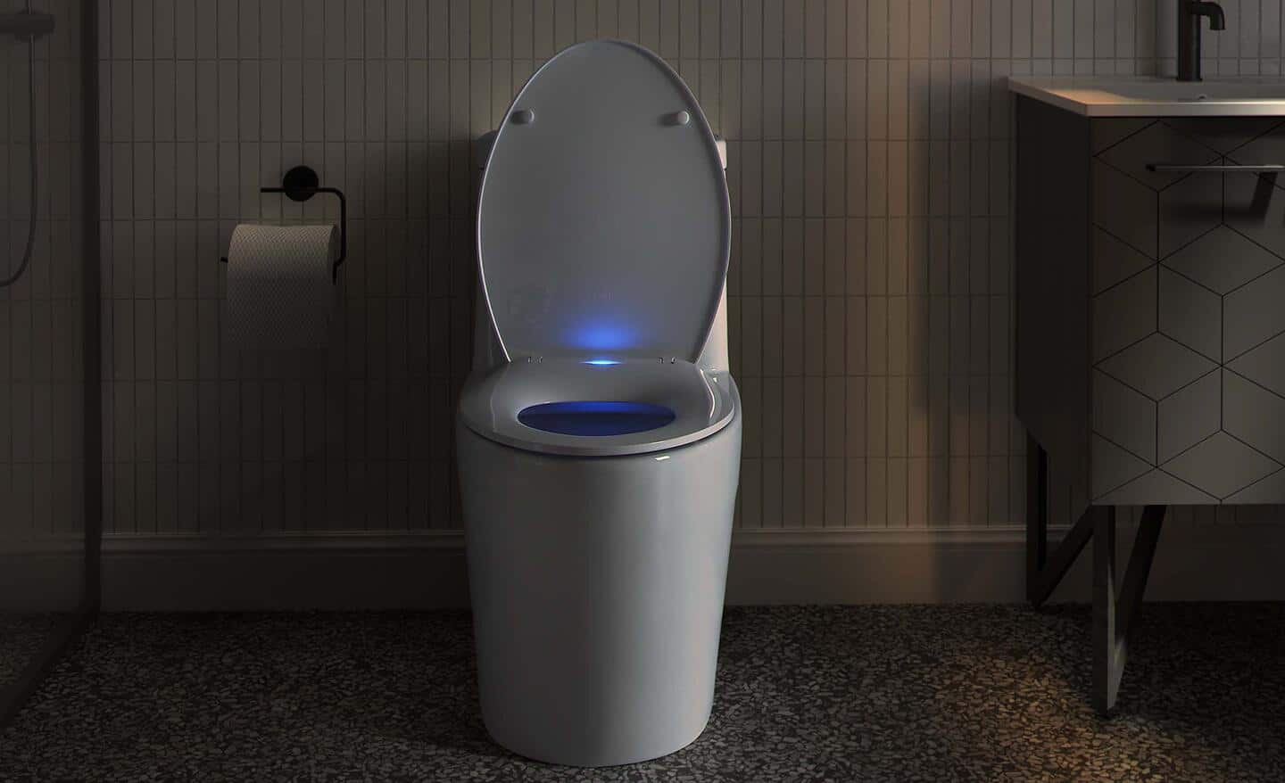 A modern toilet featuring a lighted toilet seat.