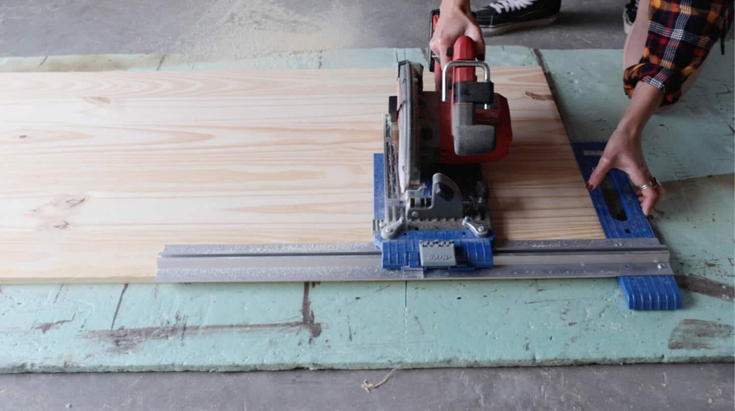A person cutting panels.