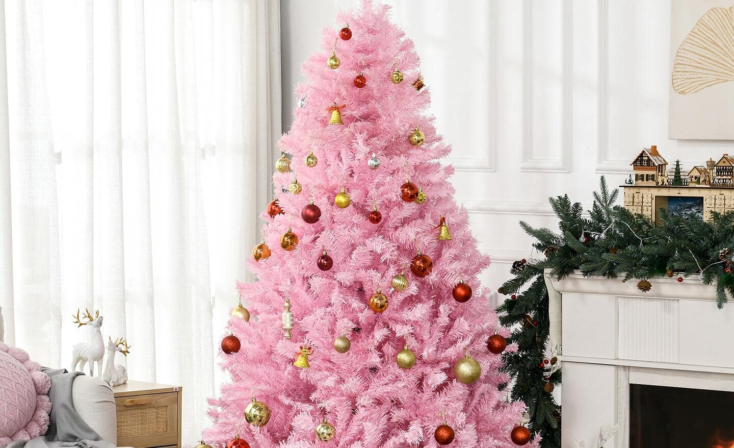 A pink Christmas tree stands in a an all-white room next to a window with sheer curtains. A pink Christmas tree stands in a an all-white room next to a window with sheer curtains.