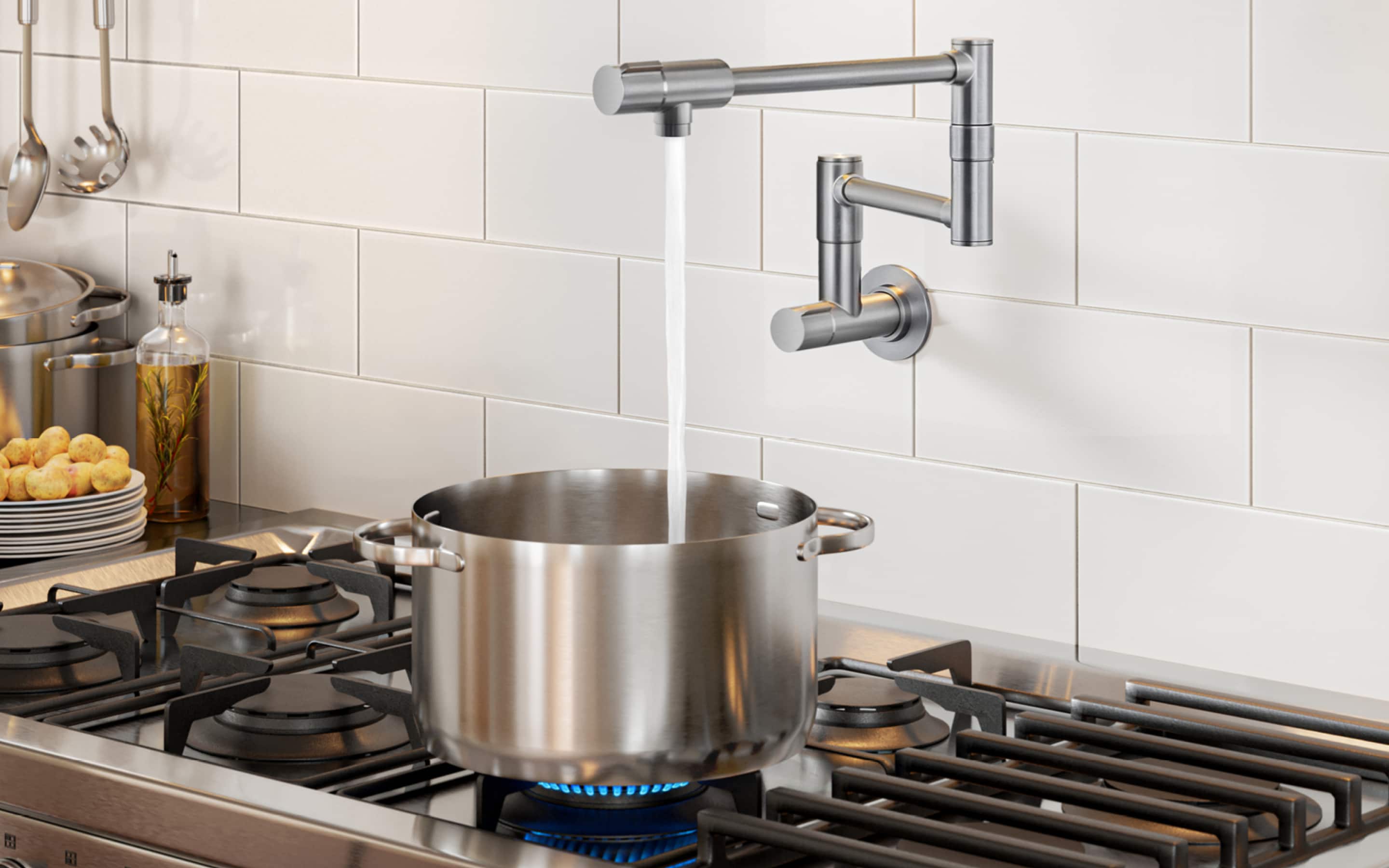 A pot filler is installed at the back of a cooktop. A pot filler is installed at the back of a cooktop.