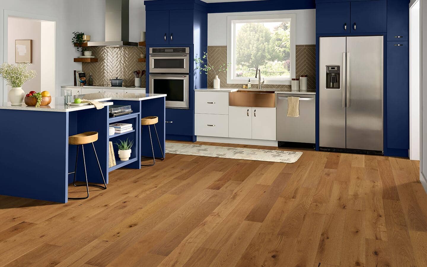 A compact studio kitchen featuring a built-in office space.