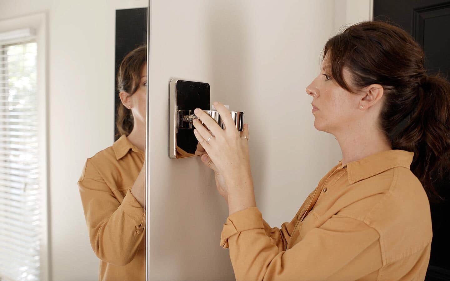 Person removing the existing light fixture. Person removing the existing light fixture.