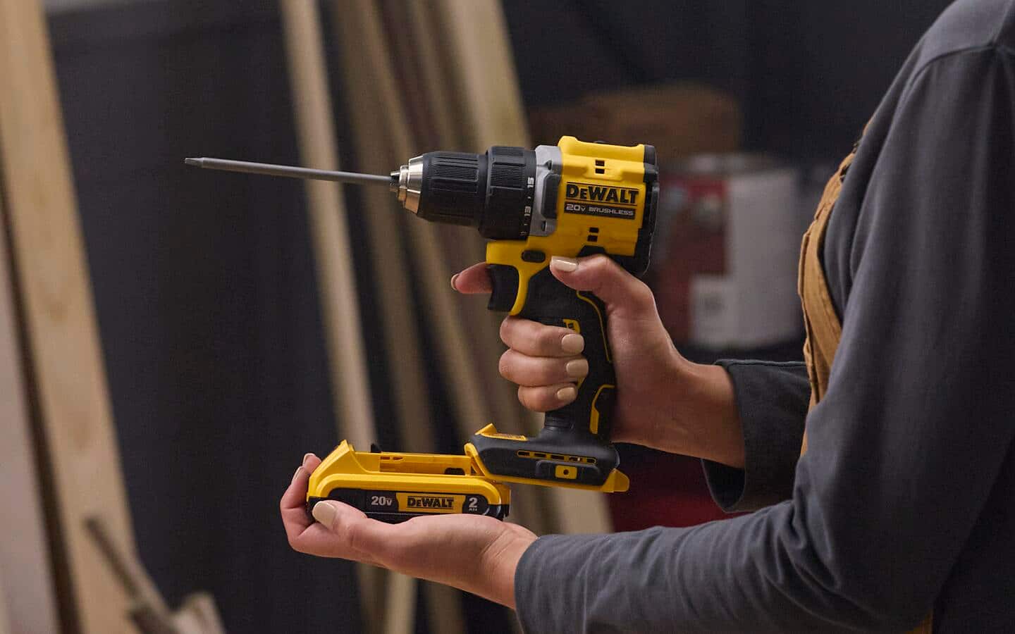 A person holds a cordless drill.