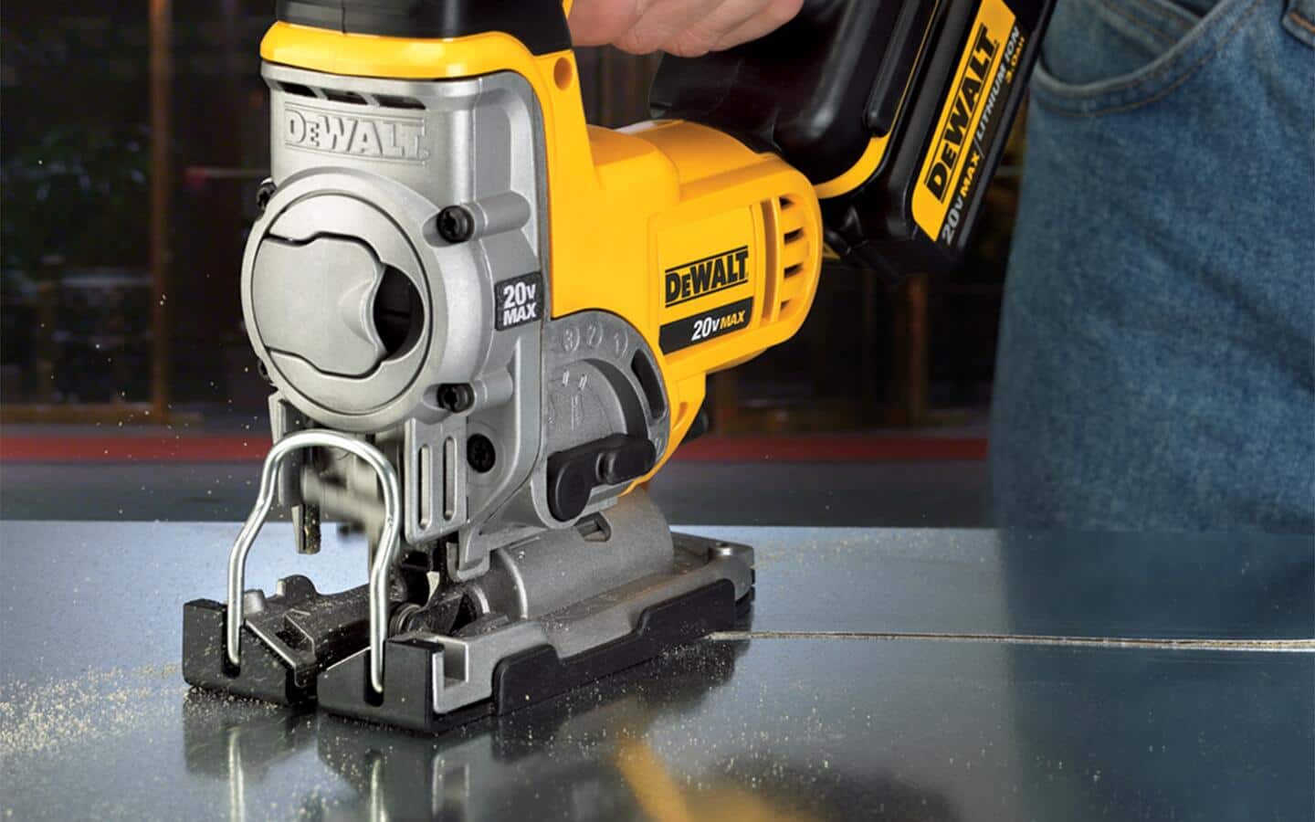 A jigsaw being used to cut metal. A jigsaw being used to cut metal.