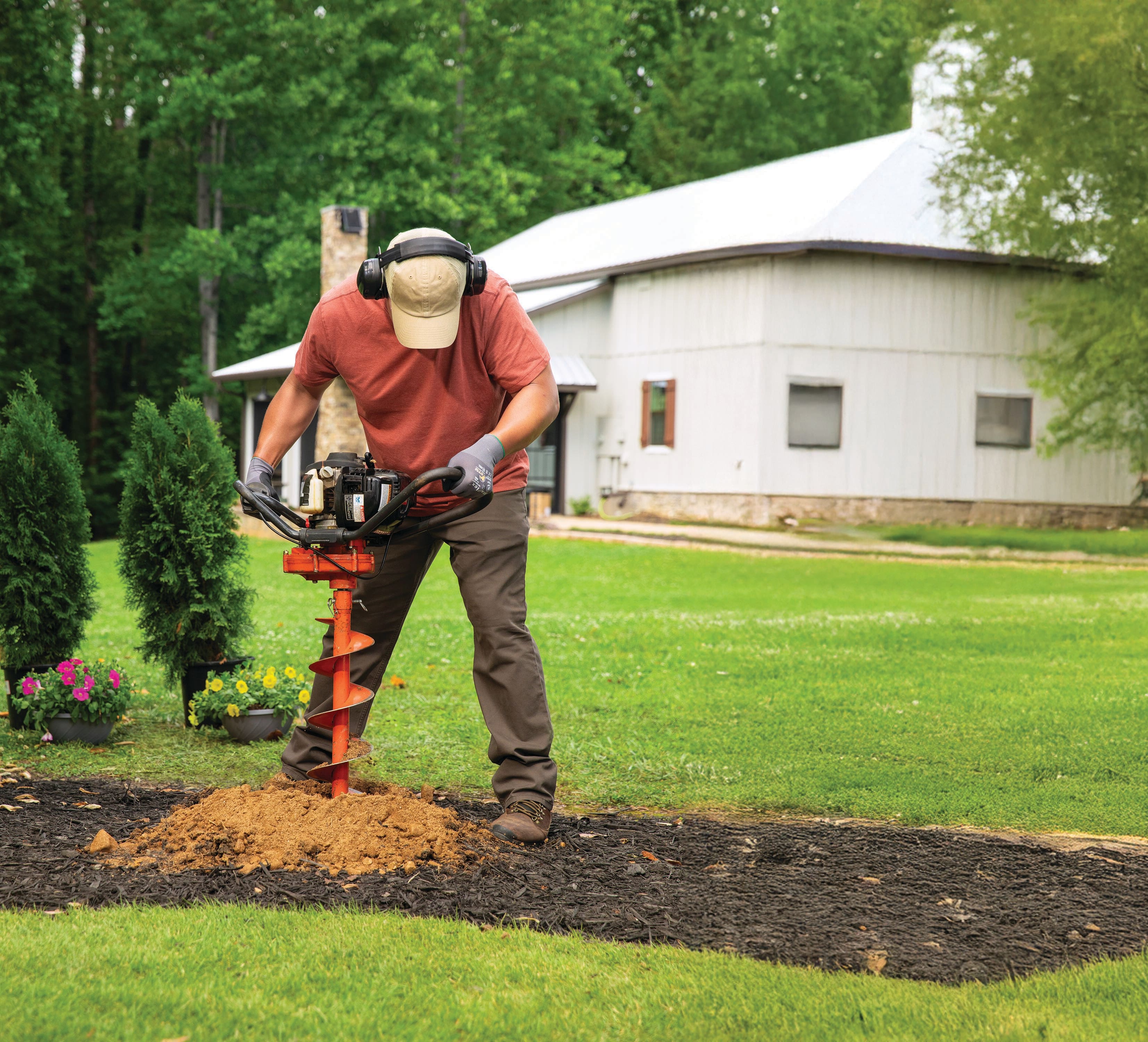 Rental Tools Fence And Post Tools. Man with Auger Pro Landscaper