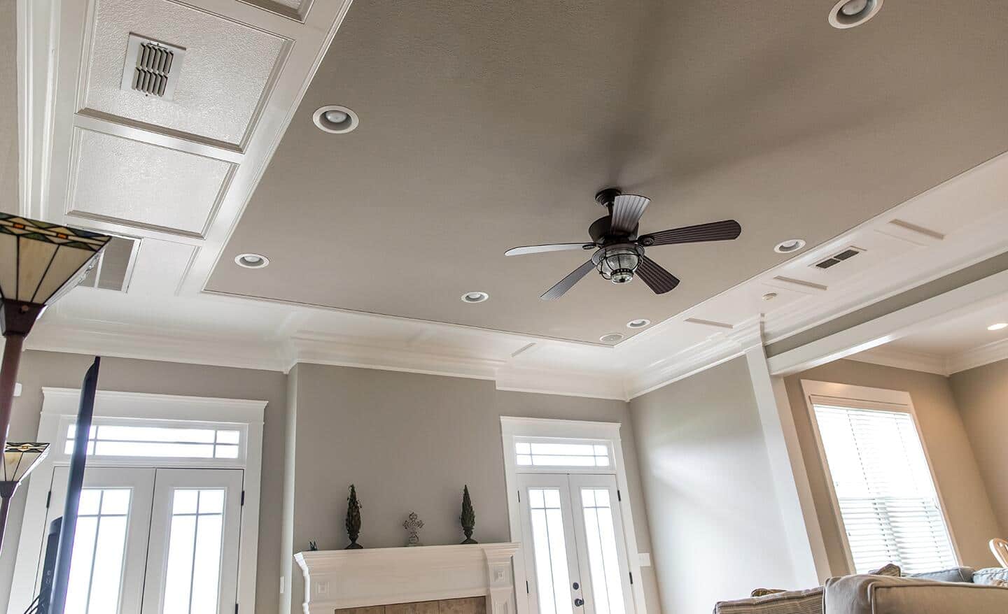 A high ceiling featuring a gray matte ceiling. A high ceiling featuring a gray matte ceiling.