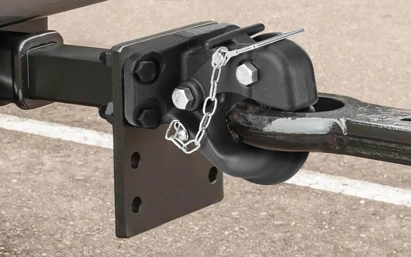 A black receiver hitch with a white chain for locking.