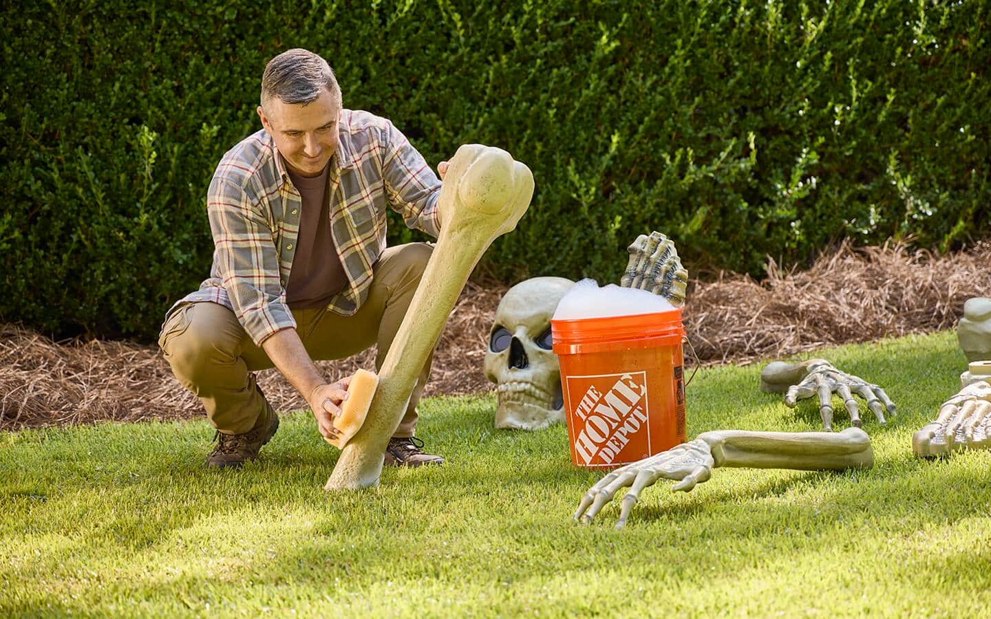 A person washes a leg bone with a sponge. A person washes a leg bone with a sponge.