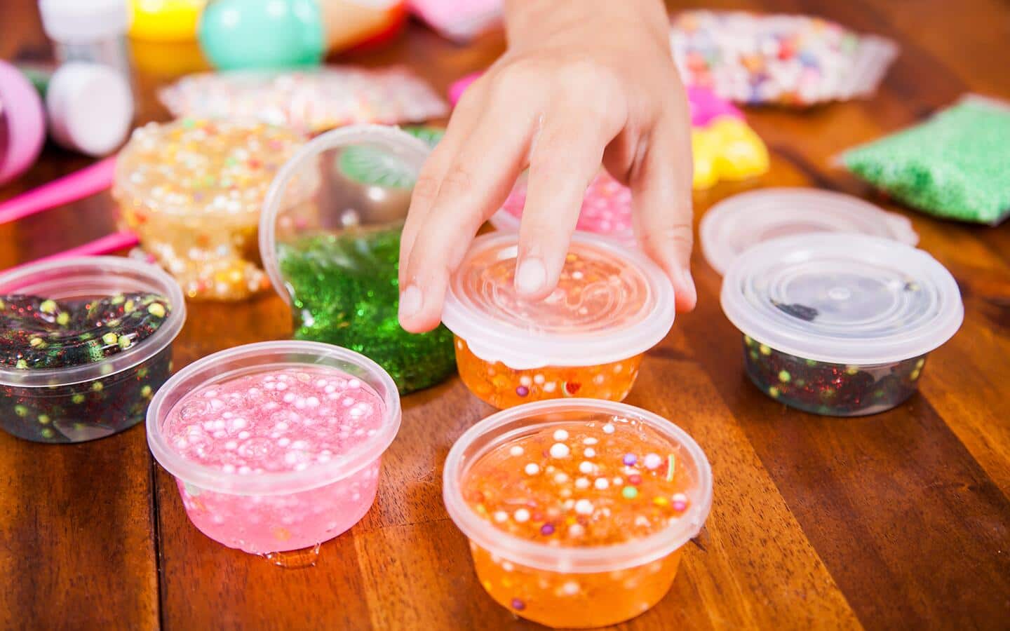 Colorful slime stored in airtight containers. Colorful slime stored in airtight containers.