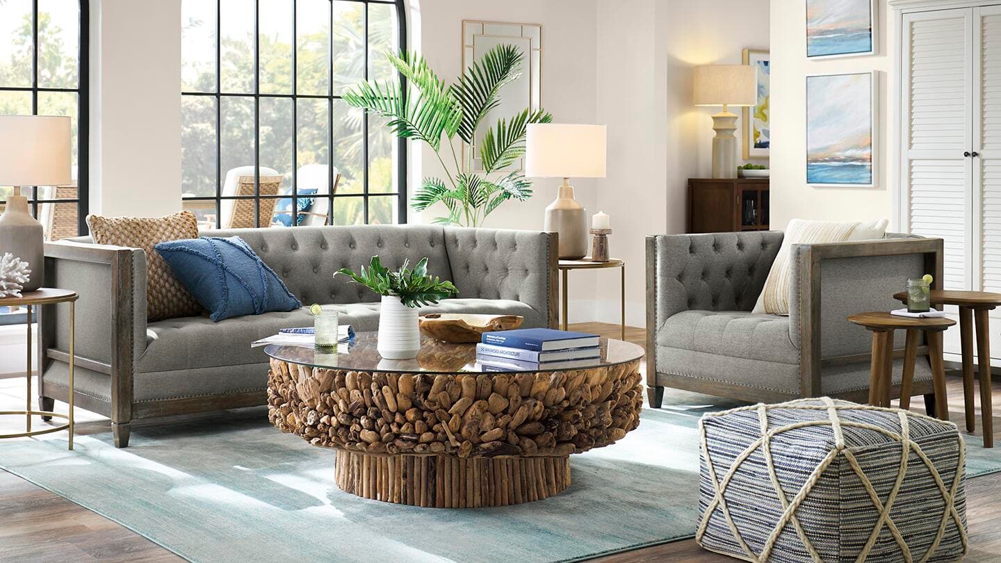 A modern living room with a round coffee table.