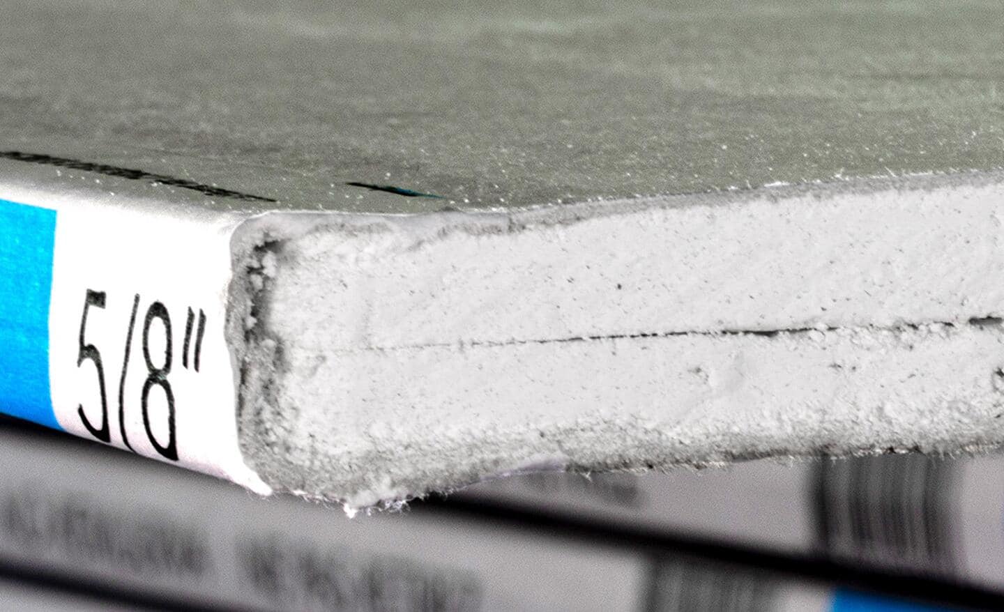 A close-up image of a drywall sheet labeled 5/8 inches thick.